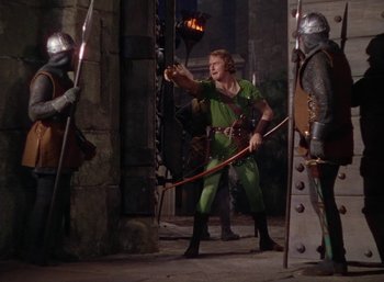 Movie still from “The Adventures of Robin Hood” (1938), directed by William Keighley – A group of men standing next to each other; Wide shot, High angle