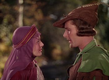 Movie still from “The Adventures of Robin Hood” (1938), directed by William Keighley – A man and a woman are looking at each other; Close Up shot, Over the shoulder angle
