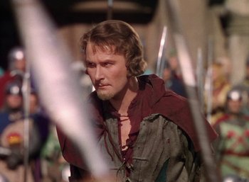 Movie still from “The Adventures of Robin Hood” (1938), directed by William Keighley – A person with a sword; Close Up shot, Over the shoulder angle