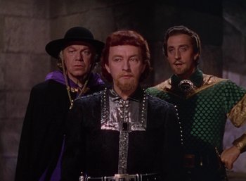 Movie still from “The Adventures of Robin Hood” (1938), directed by William Keighley – A group of men standing next to each other; Medium shot, Low angle