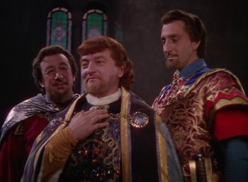 Movie still from “The Adventures of Robin Hood” (1938), directed by William Keighley – A group of men standing next to each other; Medium shot, Over the shoulder angle