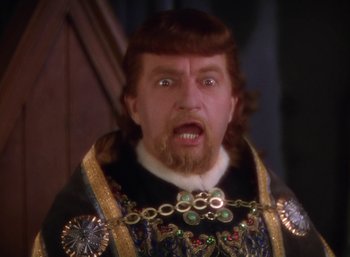 Movie still from “The Adventures of Robin Hood” (1938), directed by William Keighley – A person wearing a costume; Close Up shot, Low angle