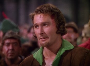 Movie still from “The Adventures of Robin Hood” (1938), directed by William Keighley – A person wearing a jacket; Close Up shot, Low angle