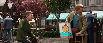 Movie still from “The Adventures of Tintin” (2011), directed by Steven Spielberg – A man holding a painting of a cartoon character on a sidewalk; Medium shot, Over the shoulder angle