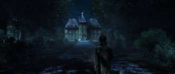 Movie still from “The Adventures of Tintin” (2011), directed by Steven Spielberg – A man standing in front of a house at night; Extreme Wide shot, Low angle