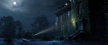 Movie still from “The Adventures of Tintin” (2011), directed by Steven Spielberg – A man is standing in front of an old building; Extreme Wide shot, Low angle