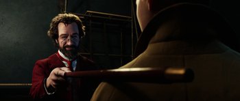 Movie still from “The Adventures of Tintin” (2011), directed by Steven Spielberg – A man with a long beard and a mustache is looking at another man with a long beard and a mustache; Close Up shot, Over the shoulder angle