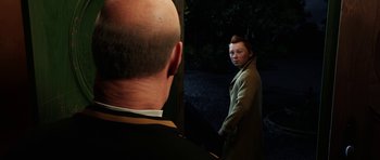 Movie still from “The Adventures of Tintin” (2011), directed by Steven Spielberg – A man standing next to another man in front of a mirror; Medium shot, Over the shoulder angle