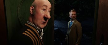 Movie still from “The Adventures of Tintin” (2011), directed by Steven Spielberg – A man and a boy are standing next to each other; Medium shot, Over the shoulder angle