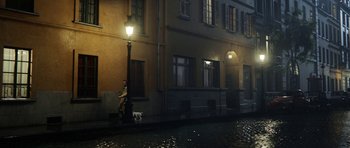 Movie still from “The Adventures of Tintin” (2011), directed by Steven Spielberg – A man and a dog on the side of a street; Extreme Wide shot, High angle