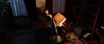 Movie still from “The Adventures of Tintin” (2011), directed by Steven Spielberg – A man sitting at a table with a dog in a living room; Wide shot, High angle