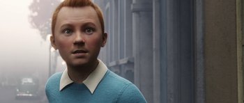 Movie still from “The Adventures of Tintin” (2011), directed by Steven Spielberg – A man with red hair wearing a blue sweater; Close Up shot, High angle