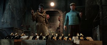 Movie still from “The Adventures of Tintin” (2011), directed by Steven Spielberg – A group of men standing next to bottles of alcohol; Medium shot, Low angle