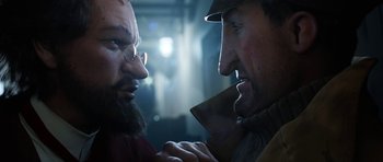 Movie still from “The Adventures of Tintin” (2011), directed by Steven Spielberg – Two men are looking at each other in the dark; Close Up shot, Over the shoulder angle