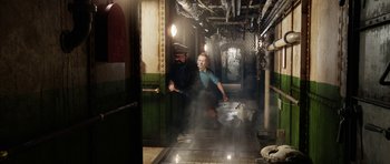 Movie still from “The Adventures of Tintin” (2011), directed by Steven Spielberg – A man and a dog in a room with steam coming out of the ceiling; Wide shot, High angle
