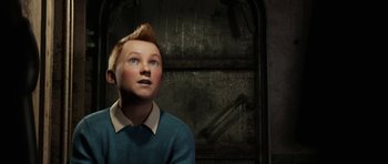 Movie still from “The Adventures of Tintin” (2011), directed by Steven Spielberg – A boy with a mohawk haircut looking up at the sky; Close Up shot, Low angle