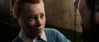 Movie still from “The Adventures of Tintin” (2011), directed by Steven Spielberg – A person wearing a blue shirt; Close Up shot, High angle