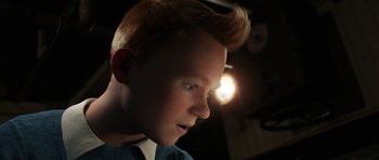 Movie still from “The Adventures of Tintin” (2011), directed by Steven Spielberg – A young boy with red hair looking into the distance; Close Up shot, High angle