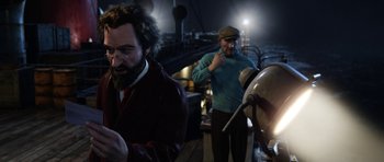 Movie still from “The Adventures of Tintin” (2011), directed by Steven Spielberg – Two men are standing next to each other; Medium shot, Over the shoulder angle