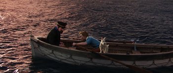 Movie still from “The Adventures of Tintin” (2011), directed by Steven Spielberg – Two men and a dog are in a small boat; Wide shot, High angle