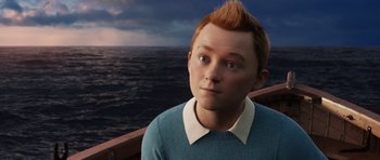 Movie still from “The Adventures of Tintin” (2011), directed by Steven Spielberg – A young man with red hair is looking at the ocean; Close Up shot, High angle