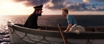 Movie still from “The Adventures of Tintin” (2011), directed by Steven Spielberg – A man and a boy are in a small boat; Medium shot, Over the shoulder angle