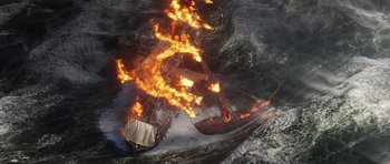 Movie still from “The Adventures of Tintin” (2011), directed by Steven Spielberg – A boat on fire in the middle of the ocean; Extreme Wide shot, Overhead angle