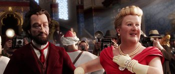 Movie still from “The Adventures of Tintin” (2011), directed by Steven Spielberg – A woman in a red dress is dancing with a man in a white suit; Close Up shot, Over the shoulder angle