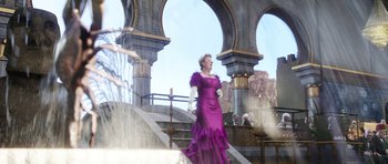 Movie still from “The Adventures of Tintin” (2011), directed by Steven Spielberg – A woman in a purple dress standing on some steps; Wide shot, Low angle