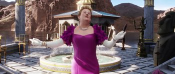Movie still from “The Adventures of Tintin” (2011), directed by Steven Spielberg – A woman in a purple dress and white gloves standing in front of a fountain; Medium shot, Low angle