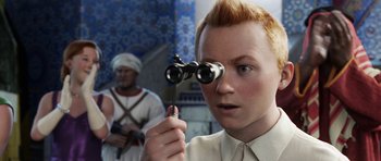 Movie still from “The Adventures of Tintin” (2011), directed by Steven Spielberg – A young man looking through a pair of binoculars; Close Up shot, High angle