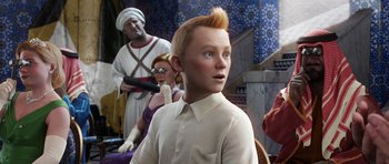 Movie still from “The Adventures of Tintin” (2011), directed by Steven Spielberg – A boy with a red mohawk is standing in front of a group of people; Medium shot, Over the shoulder angle