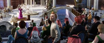 Movie still from “The Adventures of Tintin” (2011), directed by Steven Spielberg – A group of people sitting in front of a fountain; Medium shot, High angle