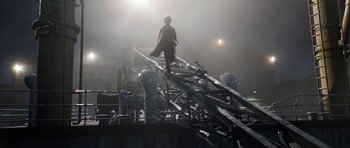 Movie still from “The Adventures of Tintin” (2011), directed by Steven Spielberg – A man walking on top of a metal structure; Extreme Wide shot, Low angle