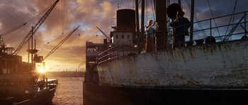 Movie still from “The Adventures of Tintin” (2011), directed by Steven Spielberg – Two people standing on the side of a boat; Extreme Wide shot, Low angle