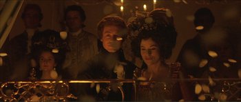 Movie still from “The Affair of the Necklace” (2001), directed by Charles Shyer – A man and a woman dressed in period clothing; Medium shot, Over the shoulder angle