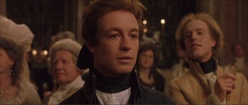 Movie still from “The Affair of the Necklace” (2001), directed by Charles Shyer – A person wearing a jacket; Close Up shot, Over the shoulder angle