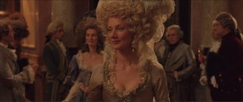 Movie still from “The Affair of the Necklace” (2001), directed by Charles Shyer – A woman in a long dress and a wig; Medium shot, Over the shoulder angle
