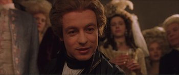 Movie still from “The Affair of the Necklace” (2001), directed by Charles Shyer – A person wearing a wig; Close Up shot, Over the shoulder angle