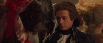 Movie still from “The Affair of the Necklace” (2001), directed by Charles Shyer – A person wearing a costume; Close Up shot, Over the shoulder angle