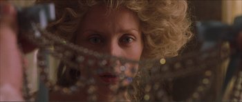 Movie still from “The Affair of the Necklace” (2001), directed by Charles Shyer – A person's face through a curtain; Close Up shot, Low angle