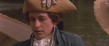 Movie still from “The Affair of the Necklace” (2001), directed by Charles Shyer – A person wearing a straw hat; Close Up shot, Over the shoulder angle