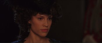 Movie still from “The Affair of the Necklace” (2001), directed by Charles Shyer – A person wearing a hat; Close Up shot, Over the shoulder angle