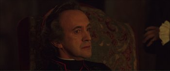 Movie still from “The Affair of the Necklace” (2001), directed by Charles Shyer – An older man is sitting in a chair; Close Up shot, High angle