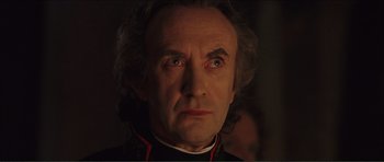 Movie still from “The Affair of the Necklace” (2001), directed by Charles Shyer – A person wearing a uniform; Close Up shot, Low angle