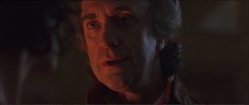 Movie still from “The Affair of the Necklace” (2001), directed by Charles Shyer – A person looking at the camera; Close Up shot, Low angle