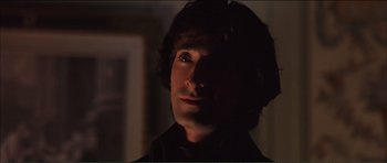 Movie still from “The Affair of the Necklace” (2001), directed by Charles Shyer – A person in a dark room; Close Up shot, High angle