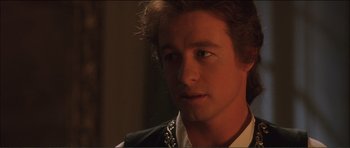 Movie still from “The Affair of the Necklace” (2001), directed by Charles Shyer – A person wearing a shirt; Close Up shot, Over the shoulder angle