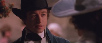 Movie still from “The Affair of the Necklace” (2001), directed by Charles Shyer – A person wearing a hat; Close Up shot, Over the shoulder angle