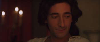 Movie still from “The Affair of the Necklace” (2001), directed by Charles Shyer – A man's face in the dark; Close Up shot, High angle